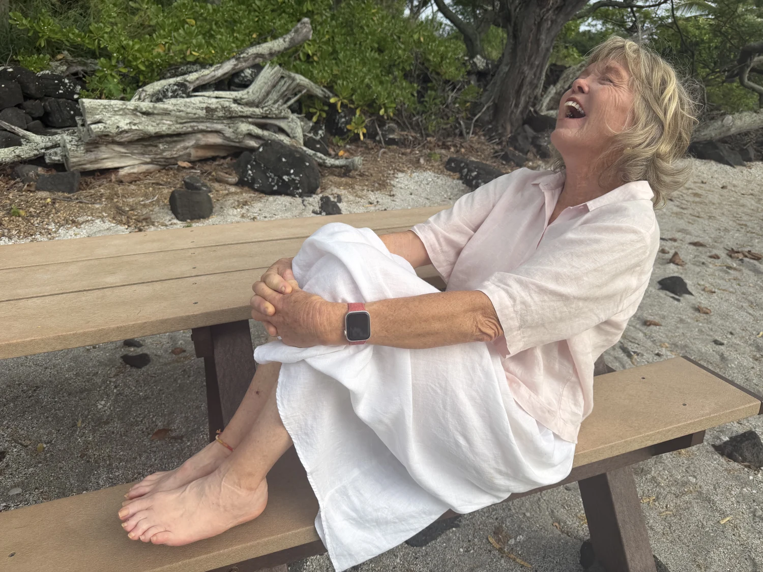 Susan laughing on the beach